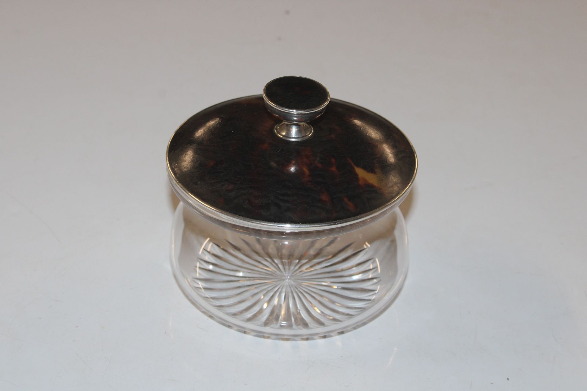 A cut glass bowl with Hallmarked silver and tortoi