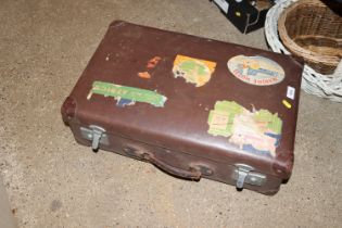 A vintage suitcase with some attached labels
