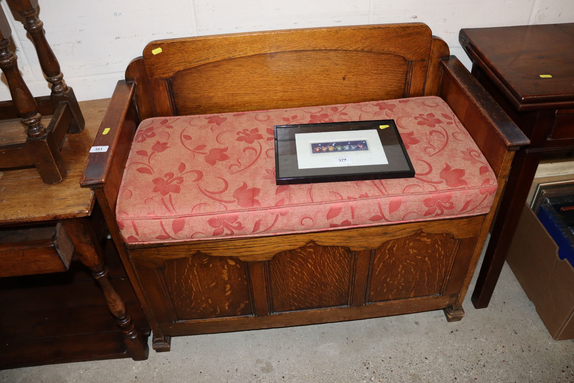 A small oak settle with lift up box seat