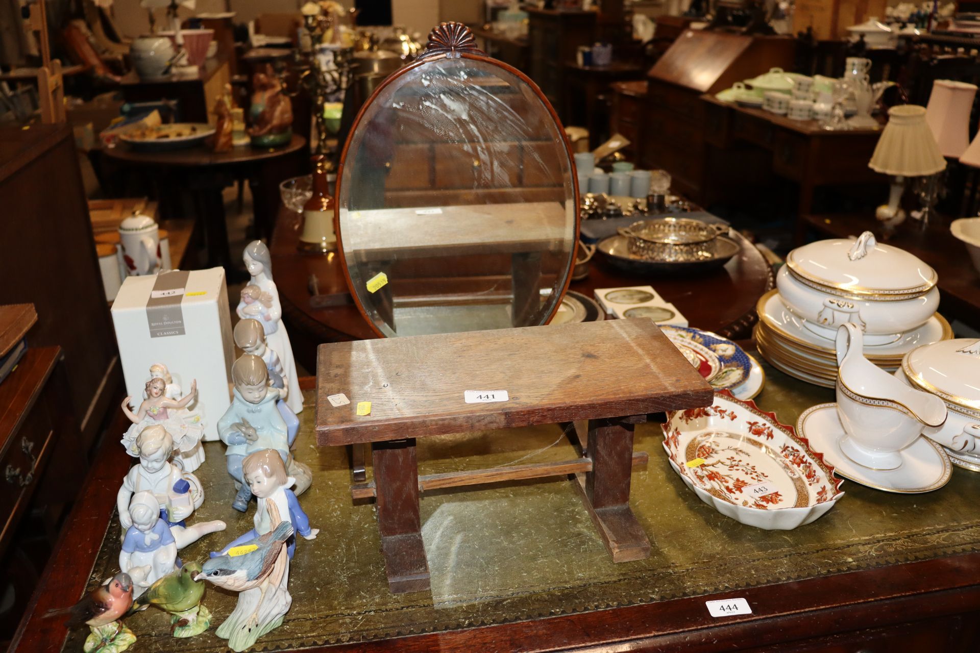 A mahogany oval swing mirror and an elm stool