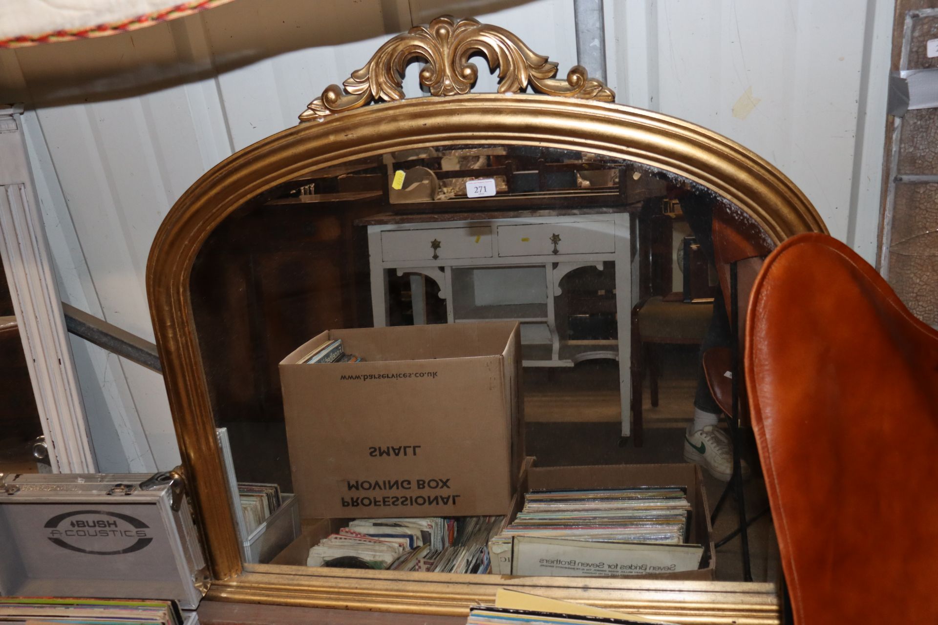 A gilt framed overmantel mirror