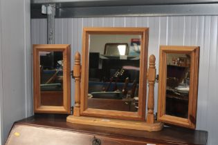 A stripped pine triple dressing table mirror