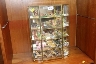 A small display cabinet and contents of ornaments