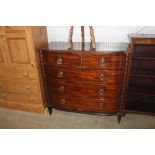 A Georgian mahogany bow fronted chest of two short and three long drawers.