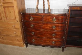 A Georgian mahogany bow fronted chest of two short and three long drawers.