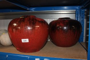 Two large red glazed pottery planters and five sto