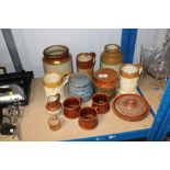 A quantity of stoneware storage jars etc.