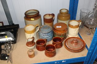 A quantity of stoneware storage jars etc.