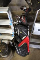 A set of Wilson golf clubs to include drivers, iro