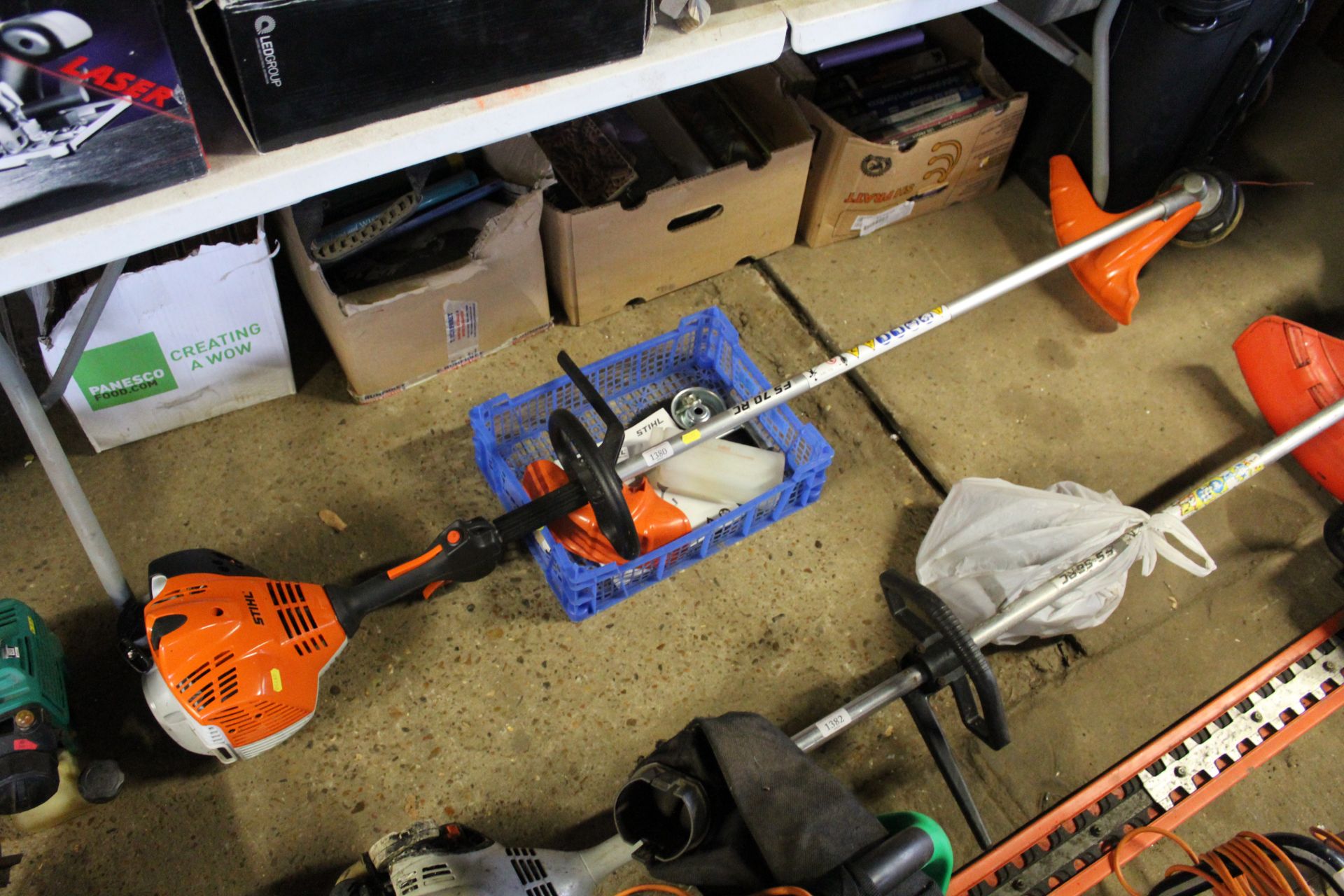 A Stihl FS70RC petrol strimmer with accessories an