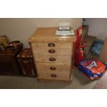 An antique pine chest fitted five graduated drawer