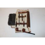 A faux tortoiseshell manicure set, two pipes etc.