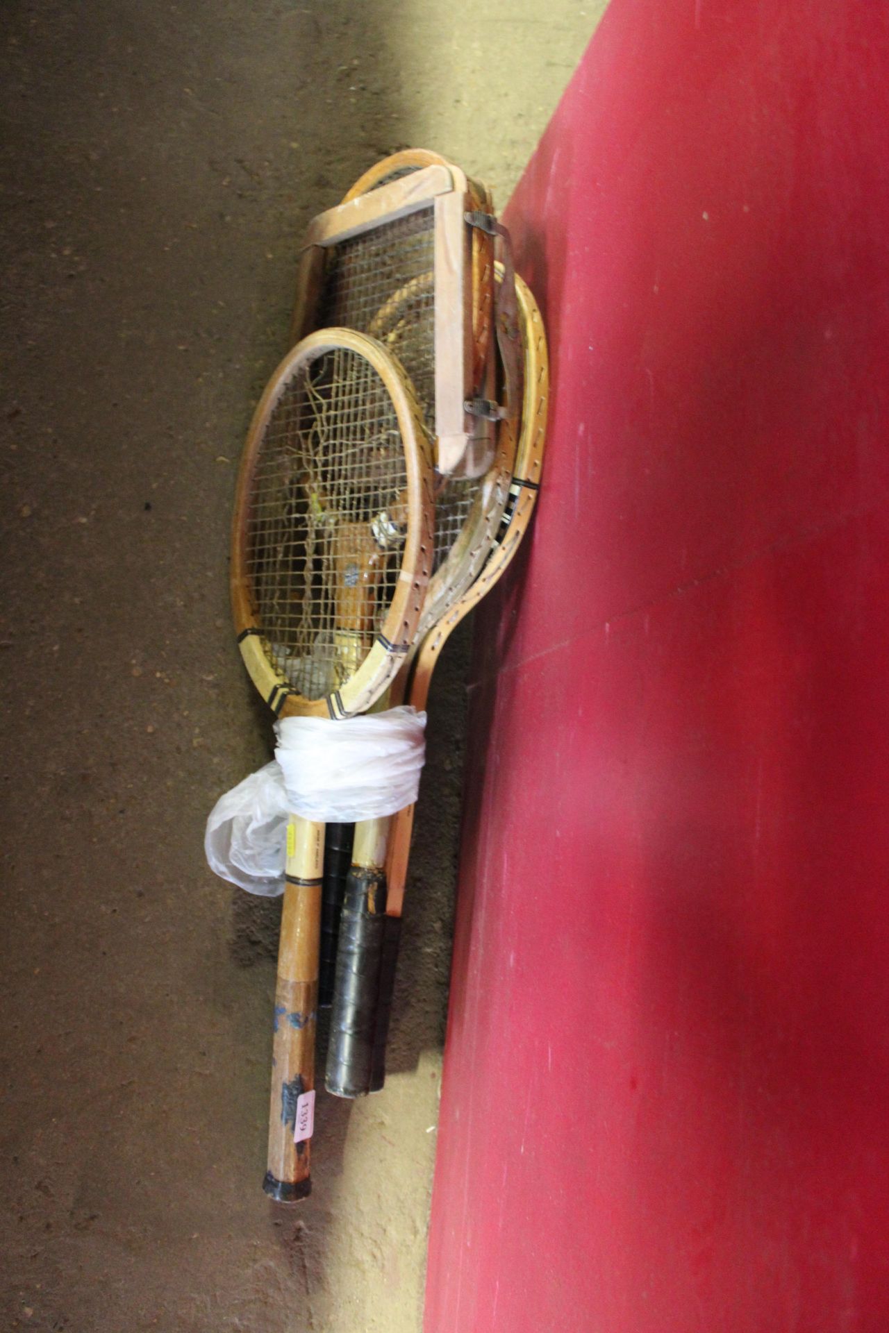 Four wooden tennis rackets