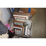 A box of various pictures, prints and frames