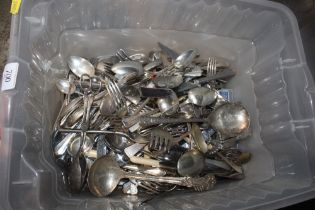 A box of miscellaneous plated flatware and cutlery