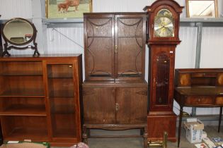 A 1930's oak bookcase on cupboard