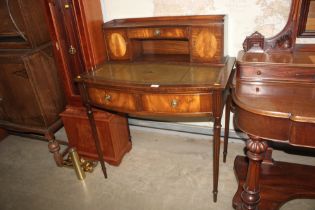 A reproduction mahogany writing desk