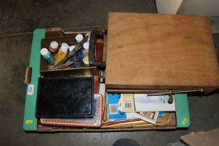 A box containing artist easel and materials