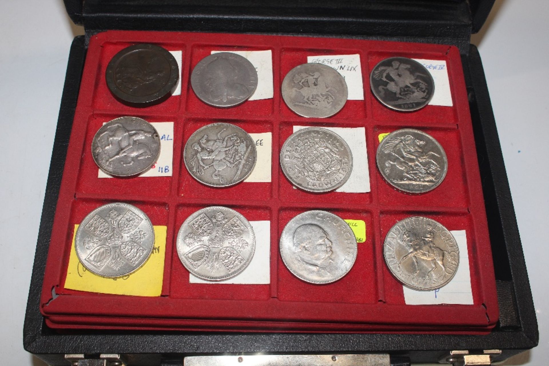 A case of silver and other coinage to include crow