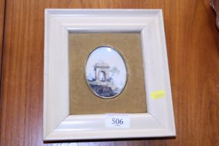 A miniature oval painting depicting a figure by a