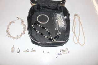 A collection of cultured and freshwater pearls wit
