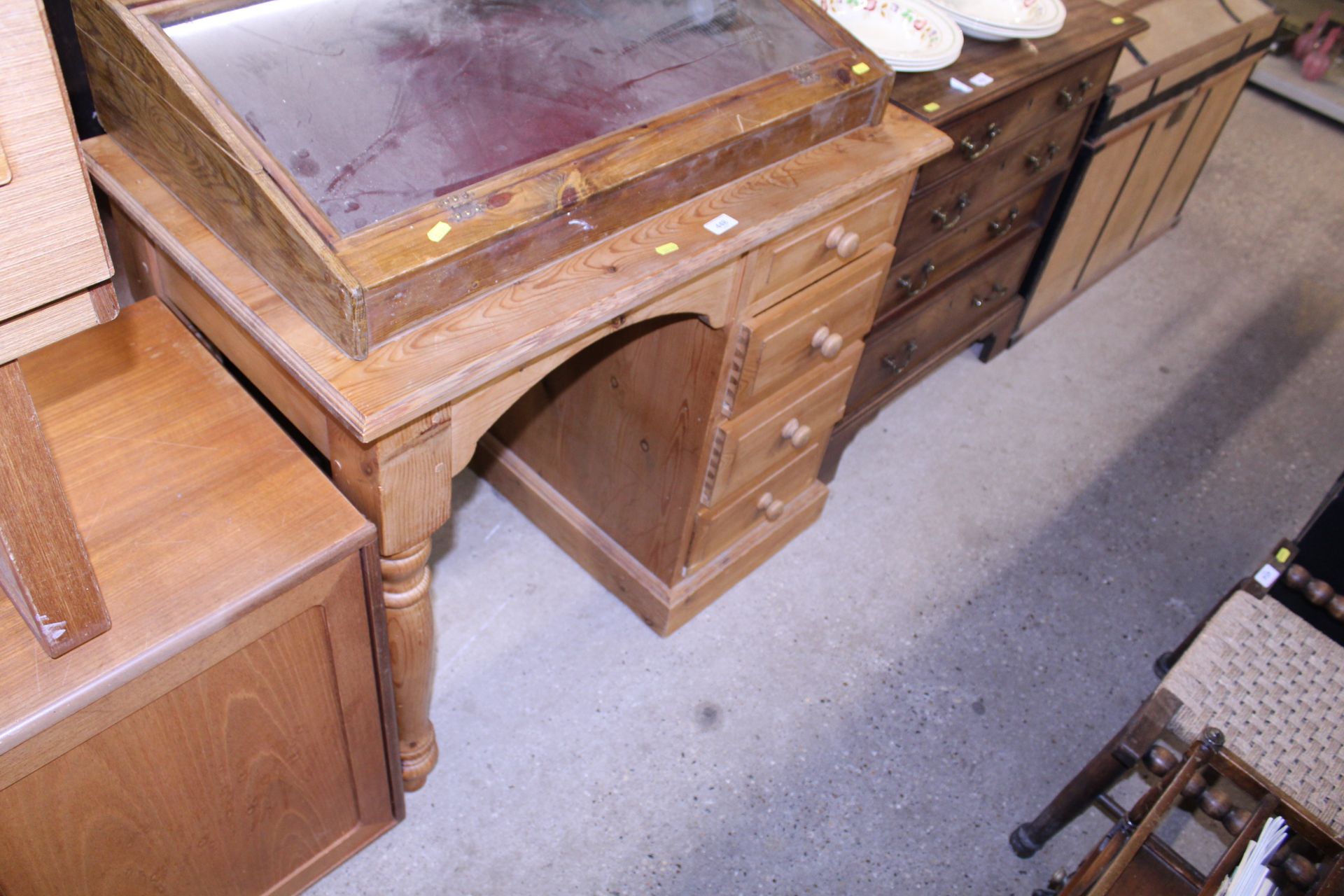 A stripped pine single pedestal desk