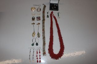 A box containing red bead necklace; a seed pearl c