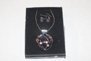 A large modernist silver and amethyst, lapis and p