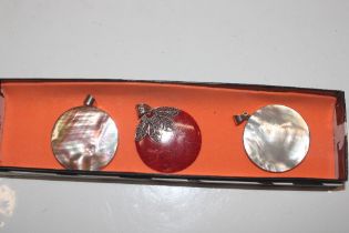 A Sterling silver and coral pendant and two simila