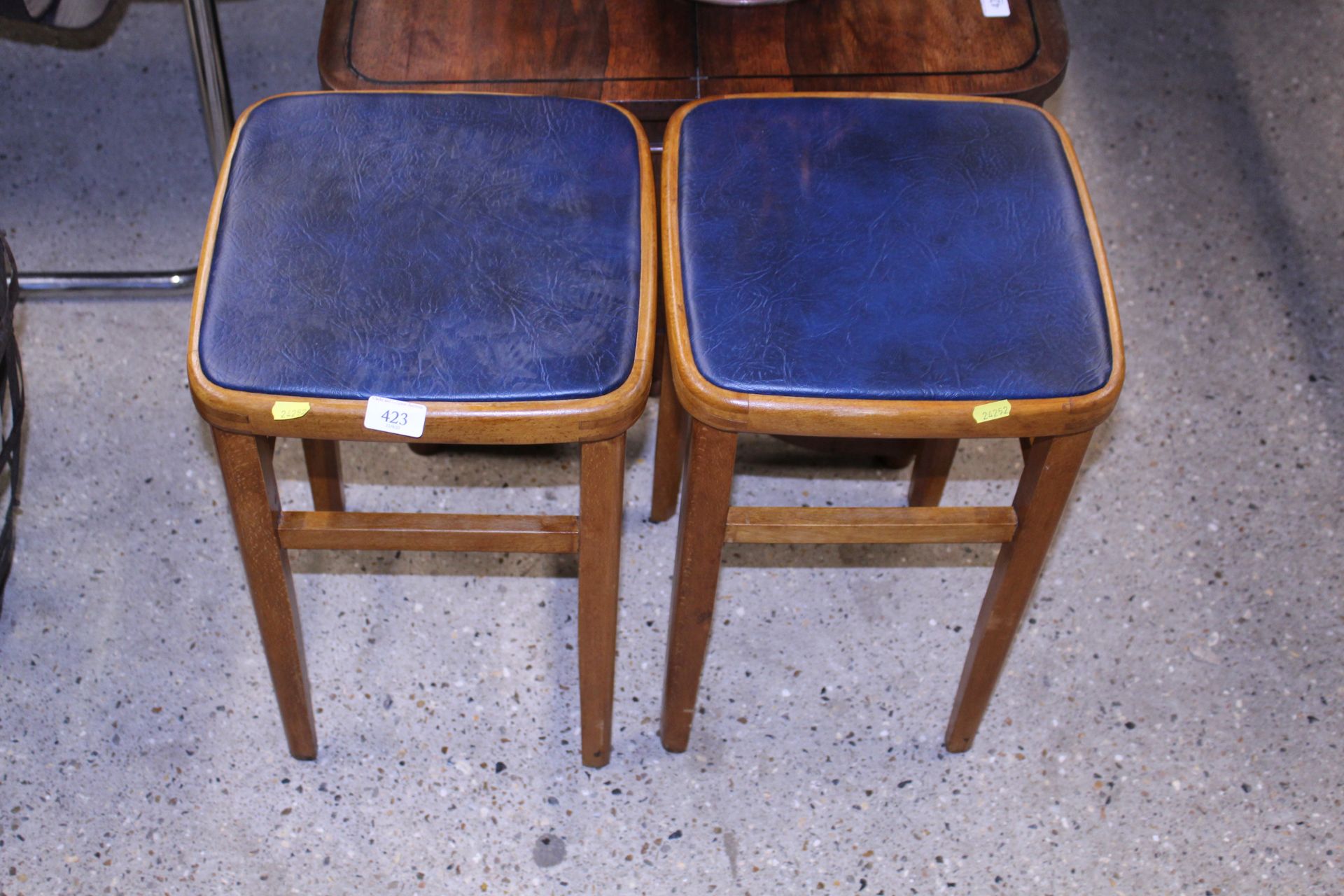 A pair of vintage beech kitchen stools