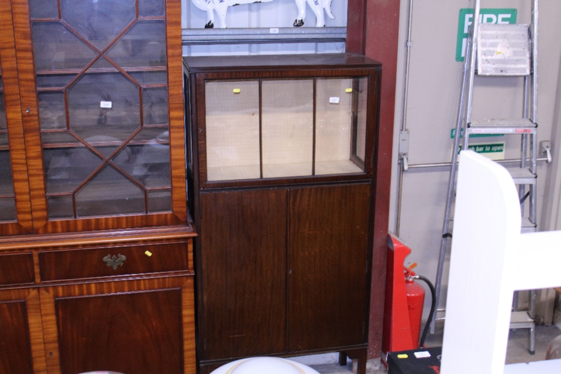 An Art Deco design mahogany display cabinet with c