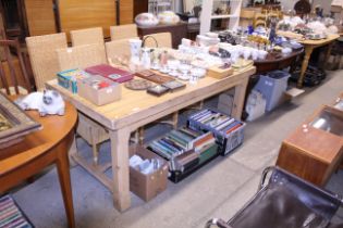 A large stripped pine kitchen table