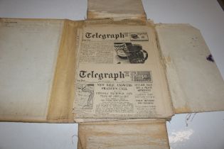A WWII folder and contents of newspaper cuttings e