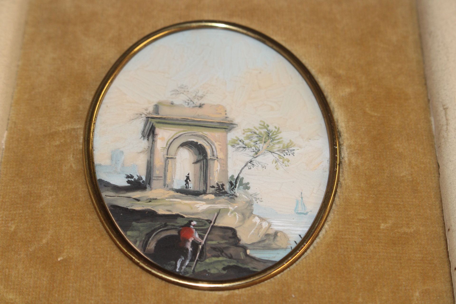 A miniature oval painting depicting a figure by a - Image 2 of 3