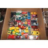 A box of various Corgi and Hot Wheels cars