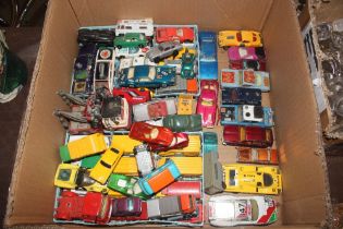 A box of various Corgi and Hot Wheels cars