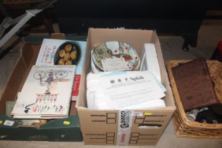 A box of miscellaneous collector's plates