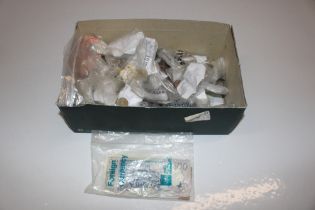 A box containing various coinage, bank notes and c