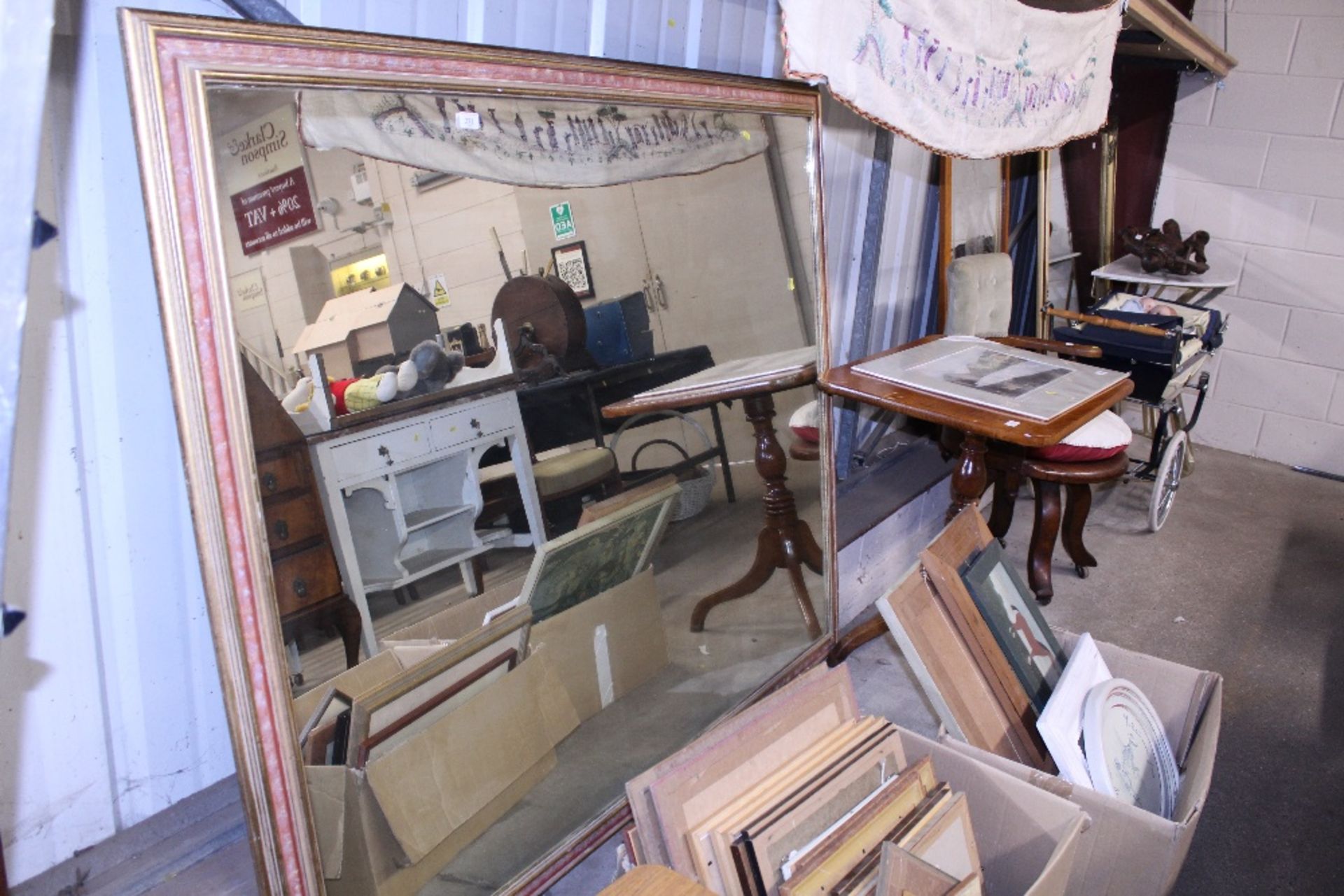 A large gilt framed mirror