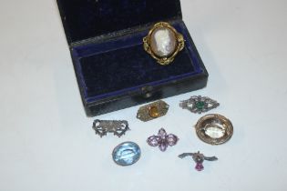 A box containing yellow metal cameo brooch, approx
