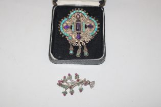 A large Mexican silver brooch set with amethyst an