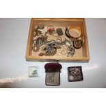 A wooden box and contents of costume jewellery inc