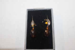 A pair of silver and amber pendant ear-rings