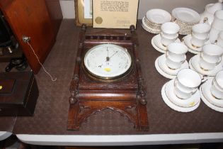 A late Victorian oak cased barometer