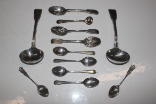 A pair of silver ladles a silver condiments spoon