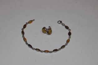 A Sterling silver and amber bracelet approx. 29gms
