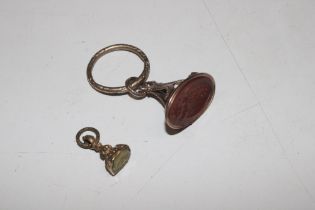 A small yellow metal mounted fob seal and a Regenc