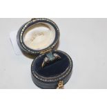 A 18ct gold ring set aquamarine coloured stone fla