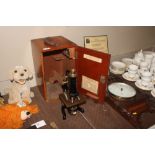 A cased microscope by Watson