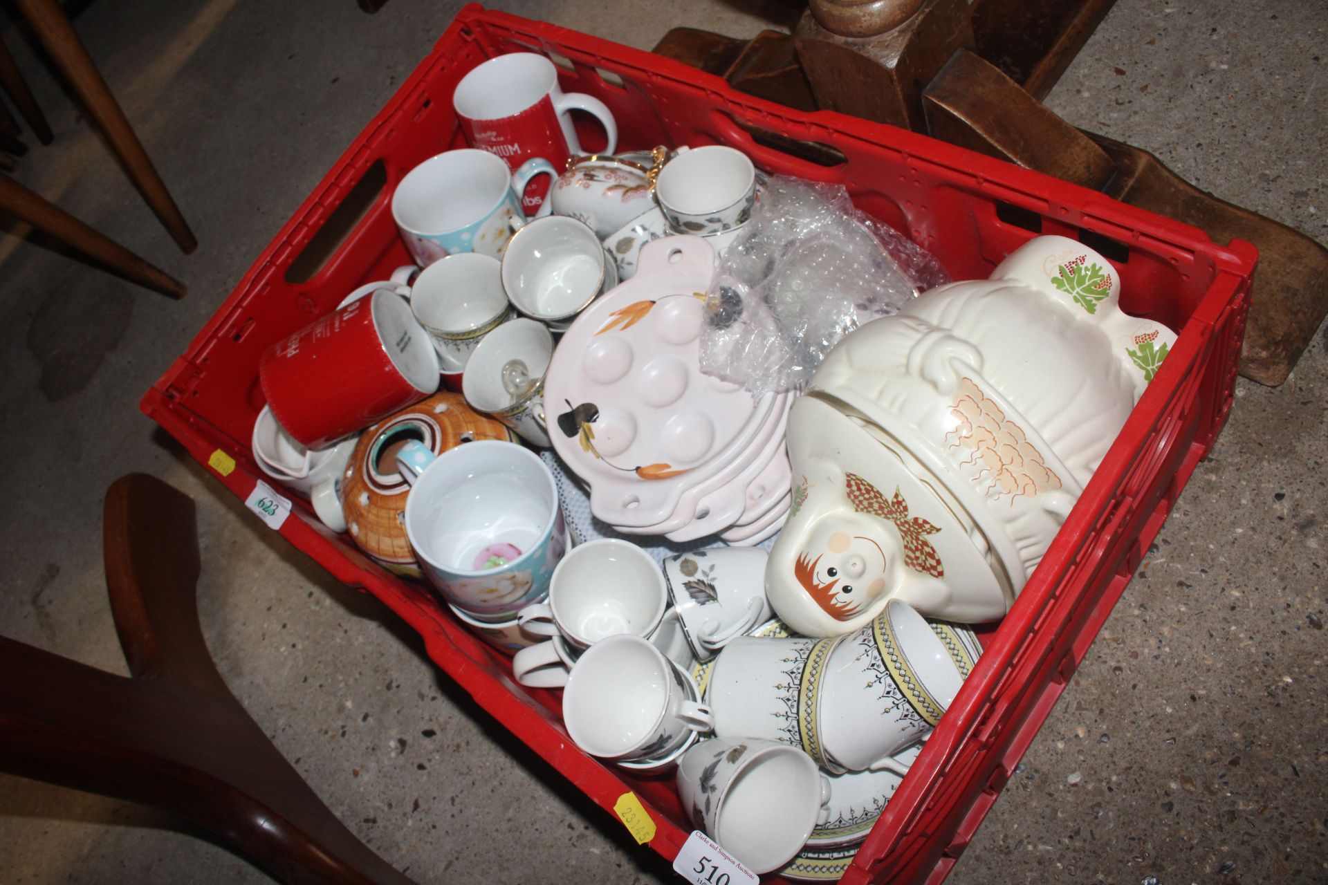 A tray containing miscellaneous teaware, storage j